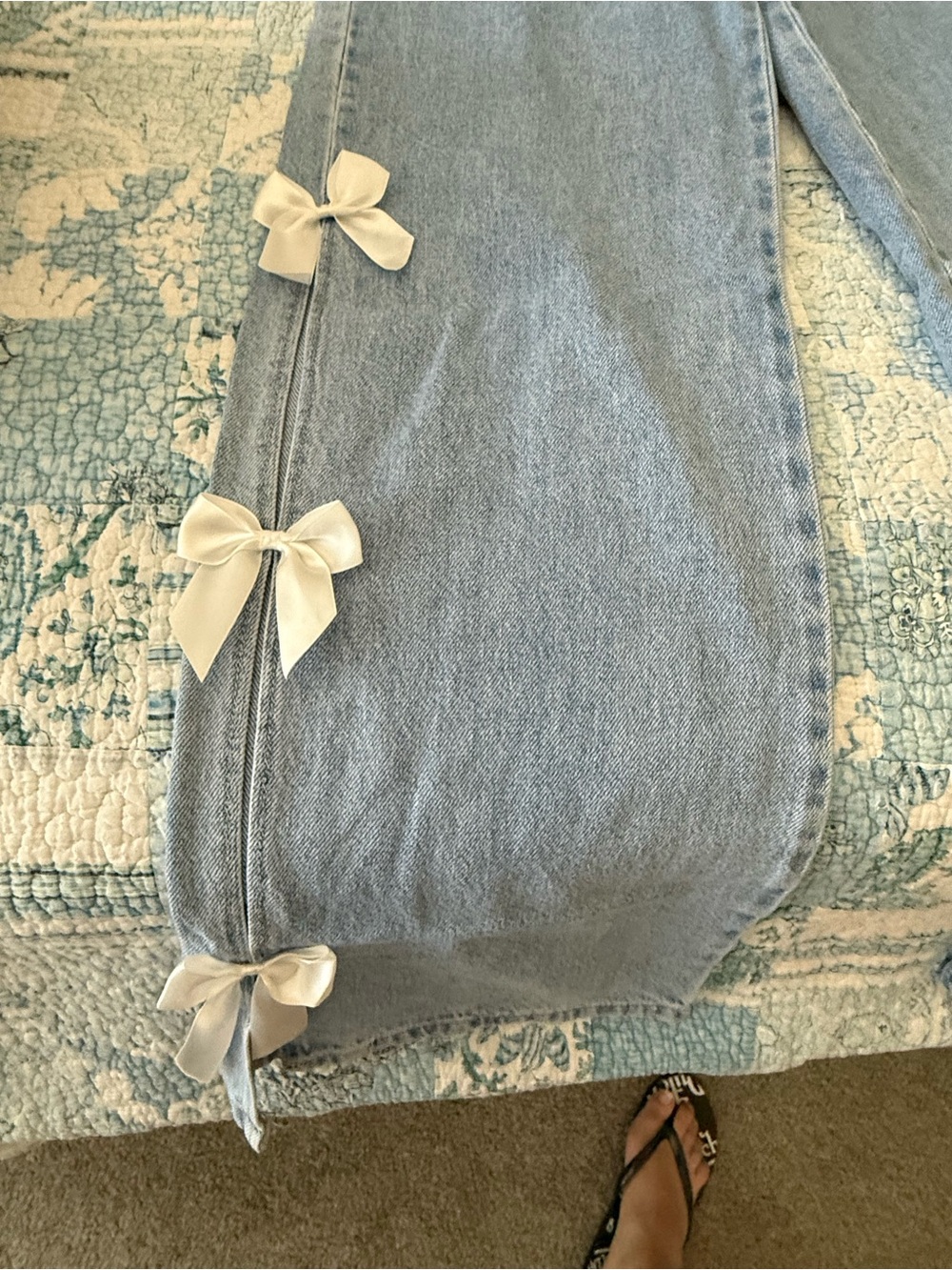 Light Wash Straight Leg Jeans with White Bow Accents